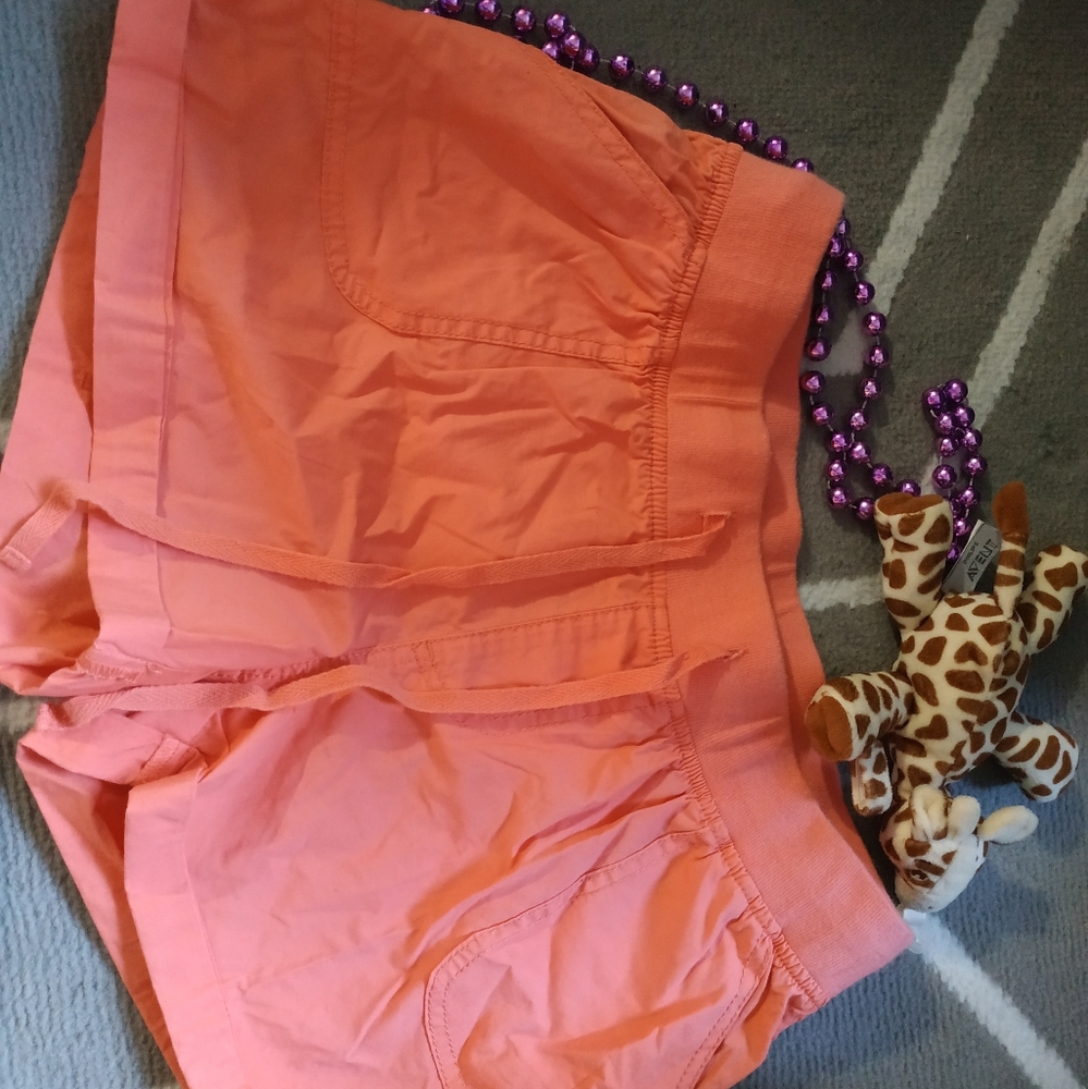 Bright pink twik hot pants.